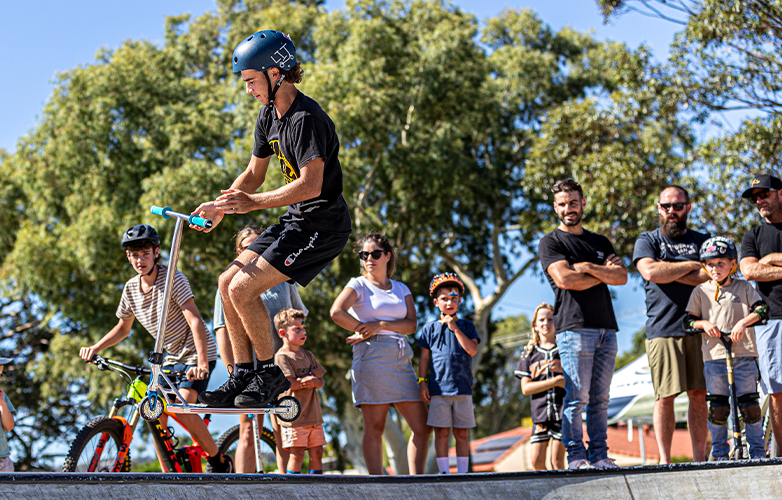 The free community celebration featured a variety of activities, including a scooter freestyle event