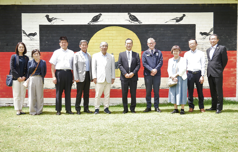 City of Moka delegates and Harvey Senior High School Principal David Gault with an Aboriginal flag mural