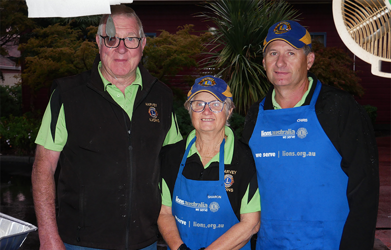 Harvey Lions Club volunteers were up early cooking sausages.