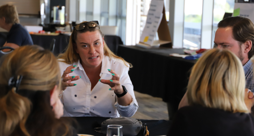 A woman explaining her idea using her hands to describe what she is thinking